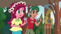 Size: 1920x1080 | Tagged: safe, derpibooru import, screencap, gloriosa daisy, timber spruce, equestria girls, legend of everfree, camp everfree outfits, clothes, female, flower, flower in hair, geode of fauna, geode of shielding, geode of sugar bombs, geode of super speed, geode of super strength, magical geodes, male, microphone, shorts