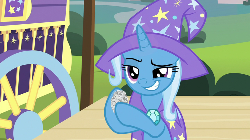 Size: 1280x720 | Tagged: safe, derpibooru import, screencap, trixie, pony, uncommon bond, crumpled, grin, hoof hold, newspaper, smiling, solo