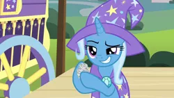 Size: 1280x720 | Tagged: safe, derpibooru import, screencap, trixie, pony, uncommon bond, crumpled, grin, hoof hold, newspaper, smiling, solo