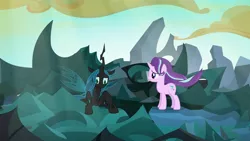 Size: 1280x720 | Tagged: safe, derpibooru import, screencap, queen chrysalis, starlight glimmer, changeling, changeling queen, pony, unicorn, to where and back again, changeling hive, cloud, duo, female, mare, ruins, sunlight, windswept mane