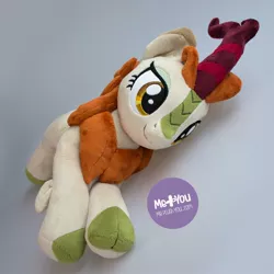 Size: 1600x1600 | Tagged: alternate version, artist:meplushyou, autumn blaze, cloven hooves, derpibooru import, female, irl, kirin, photo, plushie, prone, safe, smiling, solo, sounds of silence, watermark