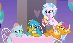 Size: 1606x957 | Tagged: safe, derpibooru import, screencap, gallus, ocellus, silverstream, smolder, changedling, changeling, classical hippogriff, dragon, gryphon, hippogriff, she's all yak, arm behind head, chair, claws, cropped, crossed legs, curved horn, cute, diaocelles, diastreamies, dragoness, feet on table, female, flapping, flippance, flying, folded wings, food, gallabetes, group, guilty, hand on cheek, horn, horns, jewelry, looking down, looking up, necklace, pearl necklace, popcorn, sad, sad face, sitting, smolderbetes, spread wings, sulking, table, talons, teenaged dragon, teenager, toes, underfoot, wings