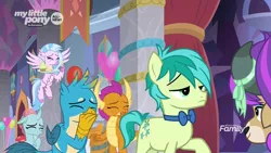 Size: 1280x720 | Tagged: safe, derpibooru import, screencap, gallus, ocellus, sandbar, silverstream, smolder, yona, changedling, changeling, classical hippogriff, dragon, earth pony, gryphon, hippogriff, pony, yak, she's all yak, amused, balloon, blinking, bowtie, claws, confused, covering mouth, cupcake, curved horn, cutie mark, discovery family logo, dragoness, eyes closed, eyeshadow, female, flying, folded wings, food, frown, horn, horns, laughing, makeover, makeup, male, oh my god, raised hoof, smiling, snickering, spread wings, student six, talons, teenaged dragon, teenager, wig, wings