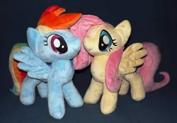 Size: 1280x893 | Tagged: safe, artist:peruserofpieces, derpibooru import, fluttershy, rainbow dash, pegasus, pony, duo, facing each other, female, implied flutterdash, implied lesbian, implied shipping, irl, long tail, mare, photo, plushie, profile, smiling, spread wings, standing, wings