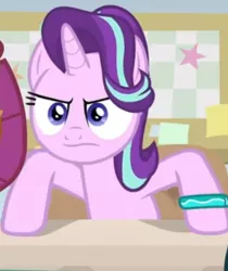 Size: 558x665 | Tagged: safe, derpibooru import, screencap, smolder, starlight glimmer, alicorn, dragon, pony, student counsel, angry, bracelet, cropped, dragoness, female, frown, hooves on the table, jewelry, mare, offscreen character, solo focus, starlight is not amused, starlight's bracelet, unamused