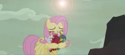 Size: 1896x832 | Tagged: safe, derpibooru import, screencap, baby cinder, baby rubble, baby sparks, fluttershy, dragon, pegasus, pony, sweet and smoky, baby, baby dragon, cute, dawwww, fluttermom, hug, lens flare, shyabetes