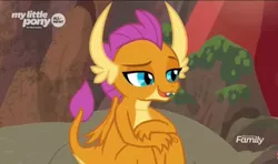 Size: 1278x758 | Tagged: claws, derpibooru import, discovery family logo, dragon, dragoness, fangs, female, folded wings, horns, lidded eyes, raised eyebrow, raised tail, safe, screencap, sitting, smiling, smolder, solo, sweet and smoky, tail, teenager, wings, young