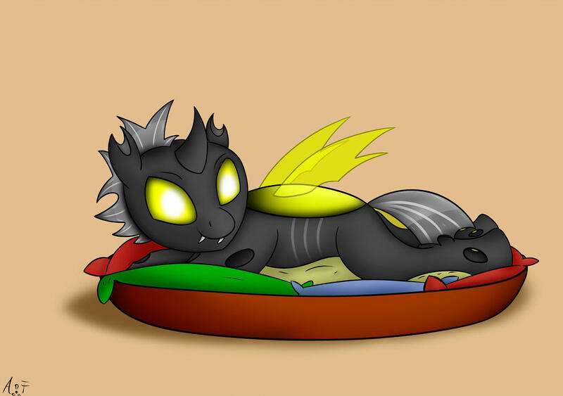 Size: 1024x721 | Tagged: artist:atomfliege, basket, changeling, changeling oc, derpibooru import, looking at you, male, oc, oc:warplix, pillow, pony in a basket, safe, simple background, solo, unofficial characters only, yellow changeling