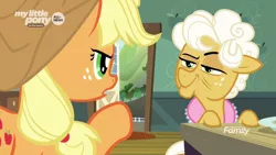 Size: 1600x900 | Tagged: safe, derpibooru import, screencap, applejack, goldie delicious, earth pony, pony, going to seed, discovery family logo, duo, female, kitchen, mare, narrowed eyes, open door, pointing, smiling, smirk, smug, table, unamused