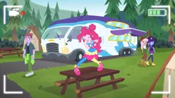 Size: 1366x768 | Tagged: safe, derpibooru import, screencap, duke suave, pinkie pie, raspberry lilac, space camp (character), equestria girls, equestria girls series, five lines you need to stand in, spoiler:eqg series (season 2), background human, female, male, picnic table, pose, rv, table