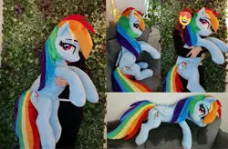 Size: 4172x2736 | Tagged: safe, artist:epicrainbowcrafts, derpibooru import, rainbow dash, human, pegasus, pony, bedroom eyes, female, holding a pony, irl, irl human, lidded eyes, life size, looking at you, looking back, looking back at you, lying down, mare, photo, plushie, sitting, smiling