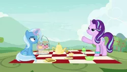 Size: 1920x1080 | Tagged: safe, derpibooru import, screencap, starlight glimmer, trixie, pony, unicorn, student counsel, bracelet, cup, duo, female, jewelry, magic, magic aura, mare, pager, picnic, picnic blanket, starlight's bracelet, starlight's hoofband, teacup, teapot, telekinesis