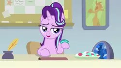 Size: 1920x1080 | Tagged: safe, derpibooru import, screencap, starlight glimmer, pony, unicorn, student counsel, bracelet, female, guidance counselor, inkwell, jewelry, lidded eyes, looking at you, mare, quill, raised hoof, solo, starlight's office