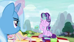 Size: 1280x720 | Tagged: safe, derpibooru import, screencap, starlight glimmer, trixie, pony, unicorn, student counsel, cute, duo, eating, eyes closed, female, food, glimmerbetes, mare, picnic, puffy cheeks, sandwich, sitting, tea