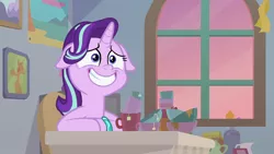 Size: 1920x1080 | Tagged: safe, derpibooru import, screencap, starlight glimmer, pony, unicorn, student counsel, bracelet, chair, cup, cute, female, floppy ears, glimmerbetes, grin, jewelry, mare, mug, sitting, smiling, solo, teabag, teacup, window
