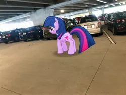 Size: 4032x3024 | Tagged: safe, derpibooru import, photographer:undeadponysoldier, twilight sparkle, pony, unicorn, augmented reality, car, female, florida, gameloft, irl, mare, orlando, parking deck, parking lot, photo, ponies in real life, solo, suv, unicorn twilight, vacation, vehicle