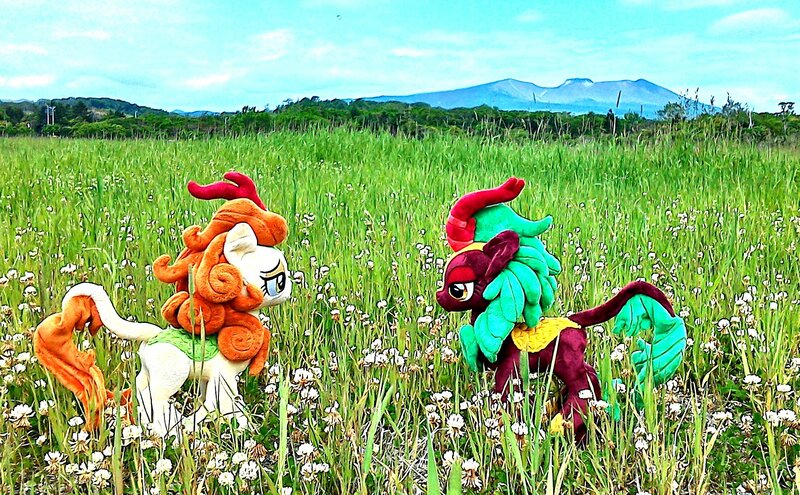 Size: 2207x1366 | Tagged: artist:hihin1993, autumn blaze, cinder glow, derpibooru import, field, grass, irl, japan, kirin, mountain, photo, plushie, safe, scenery, summer flare