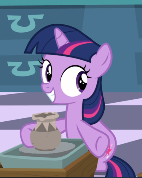 Size: 628x786 | Tagged: safe, derpibooru import, screencap, twilight sparkle, pony, unicorn, sparkle's seven, cropped, female, filly, filly twilight sparkle, pottery, raised hoof, sitting, smiling, solo, underhoof, unicorn twilight, younger