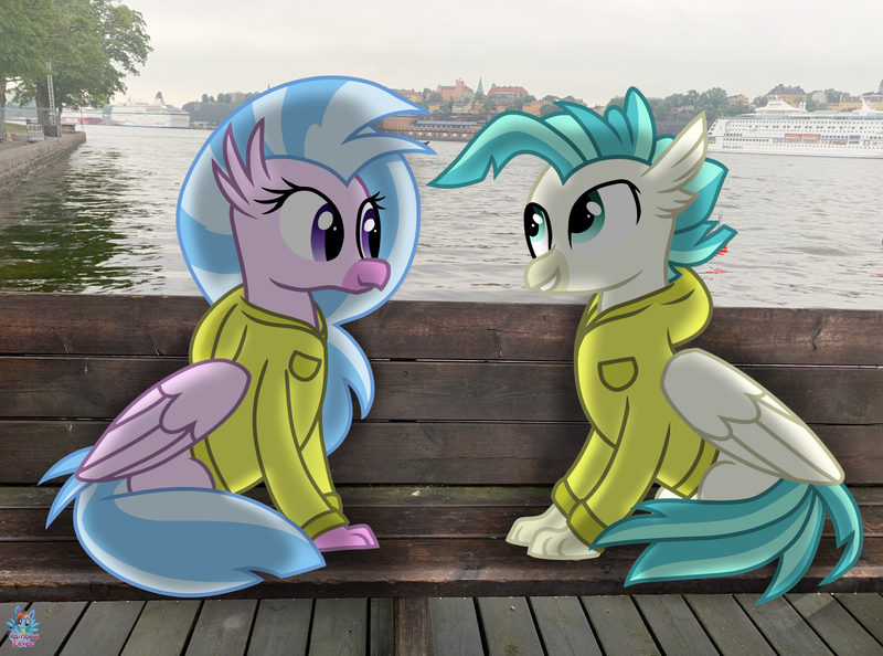 Size: 2007x1490 | Tagged: safe, artist:rainbow eevee, derpibooru import, silverstream, terramar, classical hippogriff, hippogriff, pony, bench, brother and sister, clothes, cute, diastreamies, duo, female, hoodie, irl, jacket, male, ocean, photo, ponies in real life, sibling bonding, siblings, sweden, terrabetes, tree, water