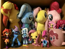 Size: 4032x3024 | Tagged: safe, derpibooru import, fluttershy, pinkie pie, sunset shimmer, trixie, equestria girls, 4de, clothes, cup, for fans by fans, funko, hot topic, merchandise, party cannon, plushie, swimsuit, toy