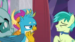 Size: 1280x720 | Tagged: safe, derpibooru import, screencap, gallus, ocellus, sandbar, smolder, changedling, changeling, dragon, earth pony, gryphon, pony, she's all yak, bowtie, claws, cringing, crossed arms, curved horn, cute, diaocelles, eyes closed, folded wings, gritted teeth, head feathers, horn, horns, jerk, lidded eyes, male, not cool, obscured face, ouch, pain, smiling, smirk, talons, teasing, teenaged dragon, teenager, wings