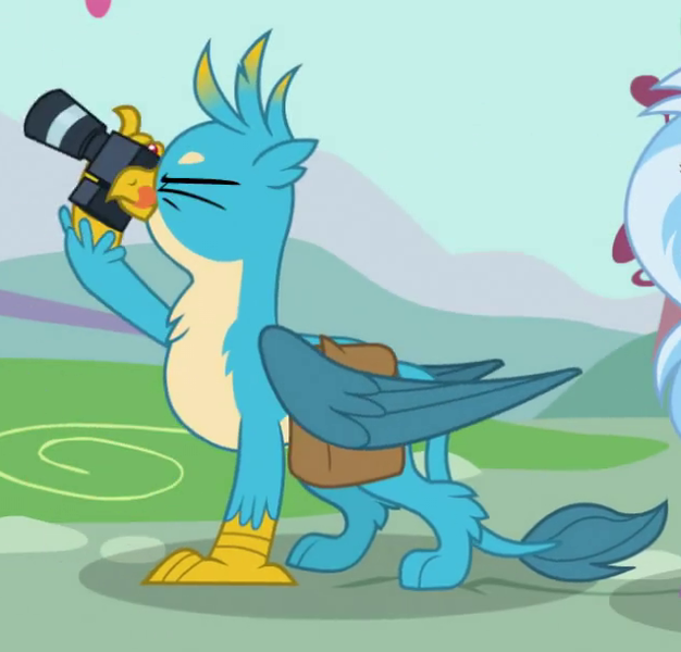 Size: 637x611 | Tagged: safe, derpibooru import, screencap, gallus, silverstream, gryphon, dragon dropped, bag, camera, chest fluff, claws, cropped, cute, gallabetes, male, male focus, offscreen character, one eye closed, paws, saddle bag, solo focus, tongue out, wings