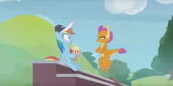 Size: 1224x614 | Tagged: safe, derpibooru import, screencap, rainbow dash, smolder, dragon, pegasus, pony, 2 4 6 greaaat, claws, coach, dragoness, duo, female, flapping, flying, folded wings, food, hat, horns, mare, narrowed eyes, popcorn, shrunken pupils, sitting, smolder is not amused, spread wings, squint, teenaged dragon, teenager, unamused, wide eyes, wings
