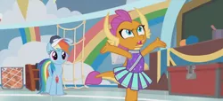 Size: 1298x592 | Tagged: safe, derpibooru import, screencap, rainbow dash, smolder, dragon, pegasus, pony, 2 4 6 greaaat, angry, arms in the air, cheerleader, cheerleader outfit, cheerleader smolder, claws, clothes, coach, coach rainbow dash, coaching cap, coaching whistle, complaining, confused, dragoness, duo, fangs, female, folded wings, frown, gym, horns, looking up, mare, multicolored mane, multicolored tail, rant, skirt, slit eyes, smolder is not amused, teacher and student, teenaged dragon, teenager, unamused, whistle, whistle necklace, wings