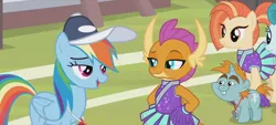 Size: 1298x588 | Tagged: safe, derpibooru import, screencap, rainbow dash, smolder, snips, dragon, pegasus, pony, unicorn, 2 4 6 greaaat, bucktooth, cheerleader, cheerleader outfit, cheerleader smolder, clothes, coach rainbow dash, coaching cap, colt, dragoness, eyeshadow, fangs, female, foal, folded wings, frown, hands on hip, horns, lidded eyes, makeup, male, mare, multicolored mane, multicolored tail, pom pom, ponytail, raised eyebrow, smiling, smirk, talking, teacher and student, teenaged dragon, teenager, whistle, whistle necklace, wings