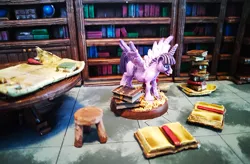 Size: 1200x785 | Tagged: safe, artist:velgarn, derpibooru import, twilight sparkle, twilight sparkle (alicorn), alicorn, pony, book, bookhorse, bookshelf, excited, figurine, gaming miniature, library, map, miniature, pewter ponies, photo, pile of books, scenery, solo, stool, table