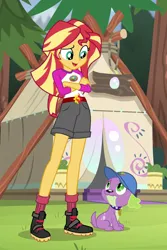 Size: 683x1022 | Tagged: safe, derpibooru import, screencap, spike, spike the regular dog, sunset shimmer, dog, equestria girls, legend of everfree, boots, camp everfree logo, camp everfree outfits, cap, clothes, collar, crossed arms, frown, hat, legs, male, paws, raised eyebrow, shoes, shorts, socks, spike's dog collar, tail, tent
