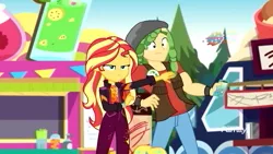 Size: 1280x720 | Tagged: safe, derpibooru import, screencap, sandalwood, sunset shimmer, equestria girls, equestria girls series, sunset's backstage pass!, spoiler:eqg series (season 2), clothes, discovery family logo, female, male, mobile phone, music festival outfit, pants, phone, smartphone