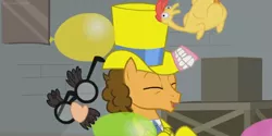 Size: 1366x682 | Tagged: safe, derpibooru import, screencap, cheese sandwich, pony, the last laugh, balloon, clothes, crates, denture, factory, fake teeth, gag factory, groucho marx, hat, rubber chicken, top hat, tuxedo