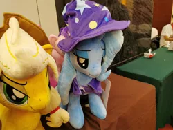 Size: 680x510 | Tagged: safe, derpibooru import, applejack, trixie, pony, chengdu, china, irl, photo, plushie, tianfu bronycon