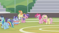 Size: 1366x764 | Tagged: safe, derpibooru import, screencap, berry blend, berry bliss, citrus blush, fluttershy, november rain, pinkie pie, rainbow dash, summer breeze, pony, 2 4 6 greaaat, bleachers, cap, field, friendship student, groan, hat, sad, whistle, wrong cutie mark