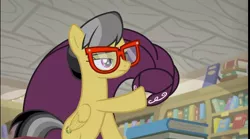 Size: 1292x720 | Tagged: safe, derpibooru import, screencap, a.k. yearling, daring do, pegasus, pony, daring doubt, book, bookshelf, cloak, clothes, eyes half closed, glasses, library, solo, we don't normally wear clothes