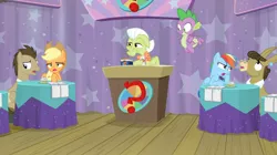 Size: 1600x898 | Tagged: applejack, a trivial pursuit, derpibooru import, doctor whooves, dragon, granny smith, groan, matilda, notepad, podium, question mark, rainbow dash, safe, screencap, spike, time turner, winged spike