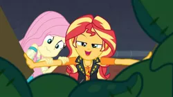 Size: 953x534 | Tagged: safe, derpibooru import, screencap, fluttershy, sunset shimmer, costume conundrum, costume conundrum: sunset shimmer, equestria girls, equestria girls series, spoiler:eqg series (season 2), geode of empathy, looking at you, magical geodes, scared, she knows