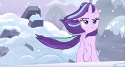 Size: 1917x1031 | Tagged: safe, derpibooru import, screencap, starlight glimmer, pony, unicorn, the ending of the end, badass, female, frown, lidded eyes, like a boss, mare, raised hoof, snow, solo, walking away, windswept mane
