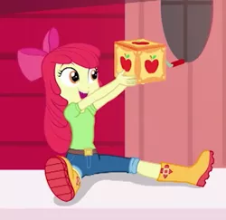 Size: 540x524 | Tagged: safe, derpibooru import, screencap, apple bloom, equestria girls, equestria girls series, holidays unwrapped, spoiler:eqg series (season 2), adorabloom, boots, box, clothes, cropped, cute, jack in the box, jack-in-the-box, shoes, sitting, smiling, solo, the cider louse fools