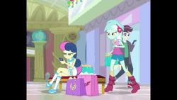 Size: 800x450 | Tagged: safe, derpibooru import, screencap, bon bon, lyra heartstrings, sweetie drops, track starr, equestria girls, equestria girls series, holidays unwrapped, spoiler:eqg series (season 2), animated, background characters doing background things, background human, bag, covering eyes, cropped, crossed legs, female, gif, guess who, happy, leaning forward, lesbian, lyrabon, present, seat, shipping, shopping mall, sitting, smiling, walking