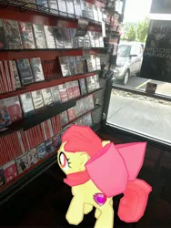 Size: 3024x4032 | Tagged: safe, derpibooru import, photographer:undeadponysoldier, apple bloom, earth pony, pony, augmented reality, female, filly, gameloft, gamestop, irl, nintendo switch, photo, ponies in real life