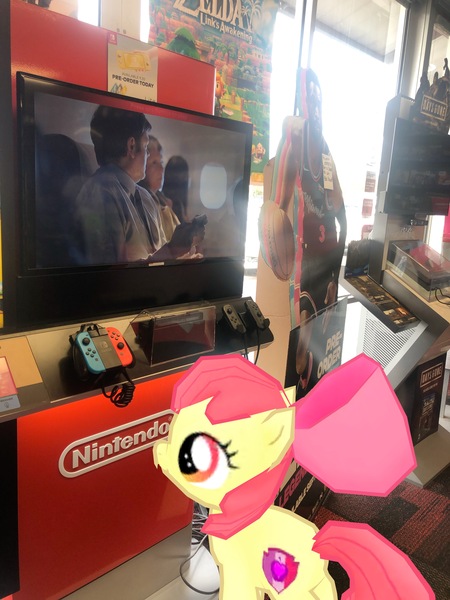 Size: 3024x4032 | Tagged: safe, derpibooru import, photographer:undeadponysoldier, apple bloom, earth pony, pony, augmented reality, controller, female, filly, gameloft, gamestop, irl, joycon, nintendo switch, photo, ponies in real life