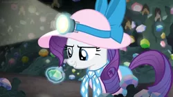 Size: 1600x900 | Tagged: safe, derpibooru import, screencap, rarity, pony, dragon dropped, bow, cave, female, gem, gem cave, hat, headlamp, lighting, magic, magic aura, mare, mine, solo, sun hat, telekinesis