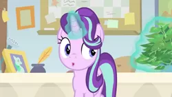 Size: 1600x900 | Tagged: safe, derpibooru import, screencap, phyllis, starlight glimmer, pony, unicorn, a horse shoe-in, bulletin board, desk, female, inkwell, levitation, magic, mare, office, philodendron, picture frame, quill, telekinesis, watering can