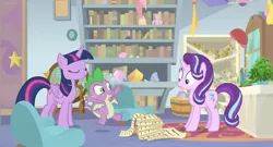 Size: 1600x862 | Tagged: safe, derpibooru import, screencap, phyllis, spike, starlight glimmer, twilight sparkle, twilight sparkle (alicorn), alicorn, dragon, pony, unicorn, a horse shoe-in, bookshelf, bucket, cabinet, chair, desk, female, house plant, mare, office, philodendron, picture frame, rug, scroll, winged spike