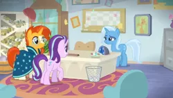 Size: 1600x900 | Tagged: safe, derpibooru import, screencap, starlight glimmer, sunburst, trixie, pony, a horse shoe-in, desk cabinet, file cabinet, office, picture frame, rug, scroll, shelf, starlight's office, vase