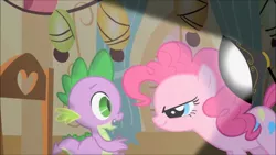 Size: 1280x720 | Tagged: safe, derpibooru import, screencap, pinkie pie, spike, dragon, earth pony, pony, party of one, chair, duo, female, interrogation, lamp, looking at each other, male, mare, smiling, smirk, smug, sugarcube corner