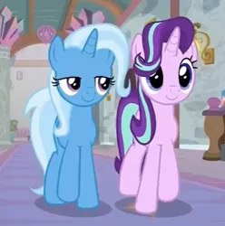 Size: 452x456 | Tagged: safe, derpibooru import, screencap, starlight glimmer, trixie, pony, unicorn, a horse shoe-in, cropped, duo, female, hair flip, hair over one eye, hallway, mare, school of friendship, shipping fuel, smiling, walking