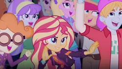 Size: 1280x720 | Tagged: safe, derpibooru import, screencap, aqua blossom, drama letter, fry lilac, golden hazel, hunter hedge, sandy cerise, scribble dee, sunset shimmer, velvet sky, watermelody, equestria girls, equestria girls series, sunset's backstage pass!, spoiler:eqg series (season 2), background human, backstage pass, female, geode of empathy, happy, logo, magical geodes, male, music festival outfit, pose, smiling, surfing, wide eyes